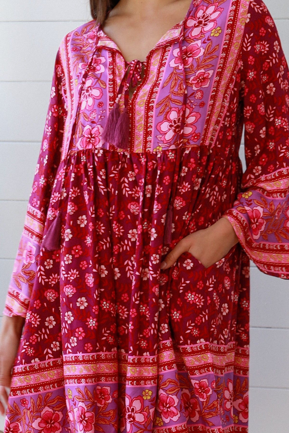 Raspberry floral bohemian mini dress with border print and flared sleeves Australian boho fashion