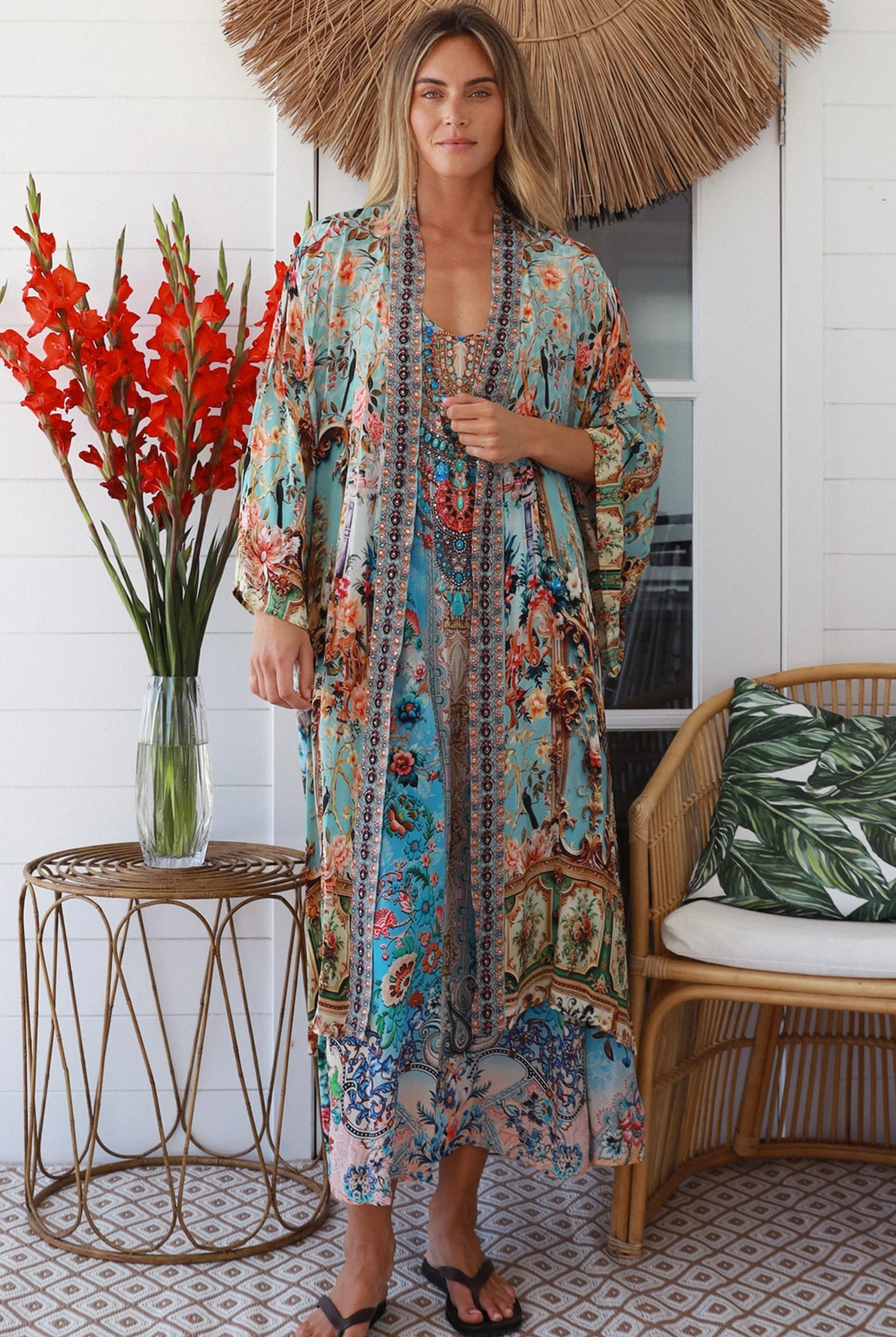 Woman wearing blue floral crepe - viscose boho kimono with side splits - Peacock Feather Resort Luxe Australia.