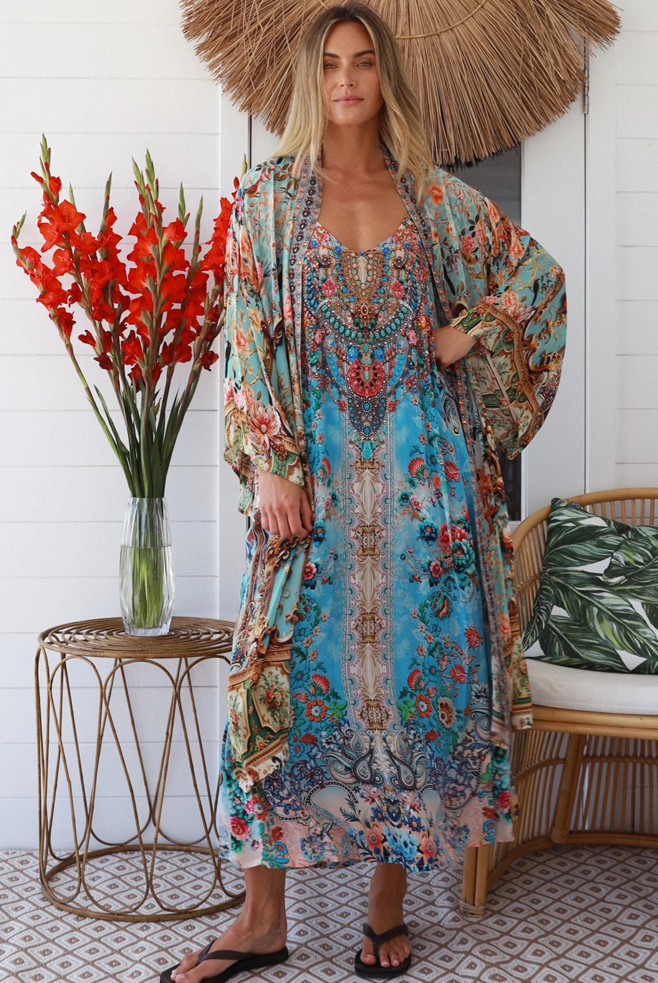 Woman wearing blue floral crepe - viscose boho kimono with side splits - Peacock Feather Resort Luxe Australia.