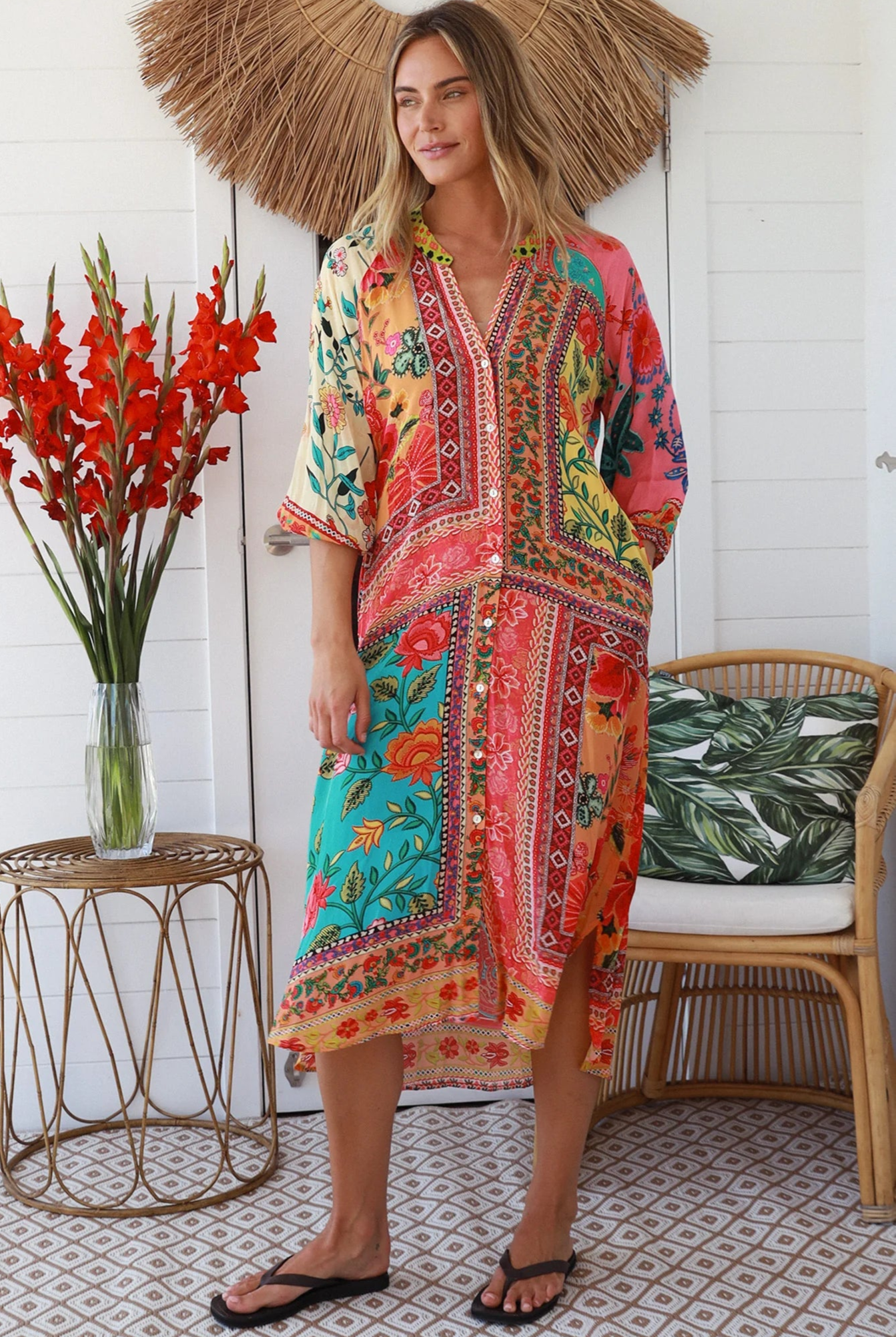 Woman in a colourful viscose-crepe boho patchwork midi dress with v-neck collar, button front & 3/4 sleeves.