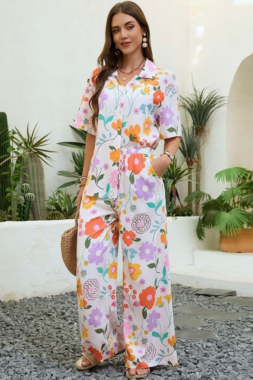 Vintage floral wide-leg pants with elastic waist and soft pastel print in a relaxed boho silhouette