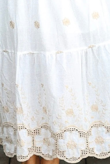 White cotton maxi dress with warm beige embroidery and scalloped embroidered hemline.