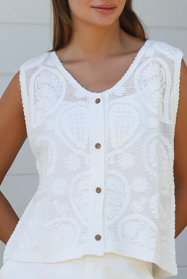 White cotton embroidered sleeveless vest with button front styled for Australian summer boho fashion