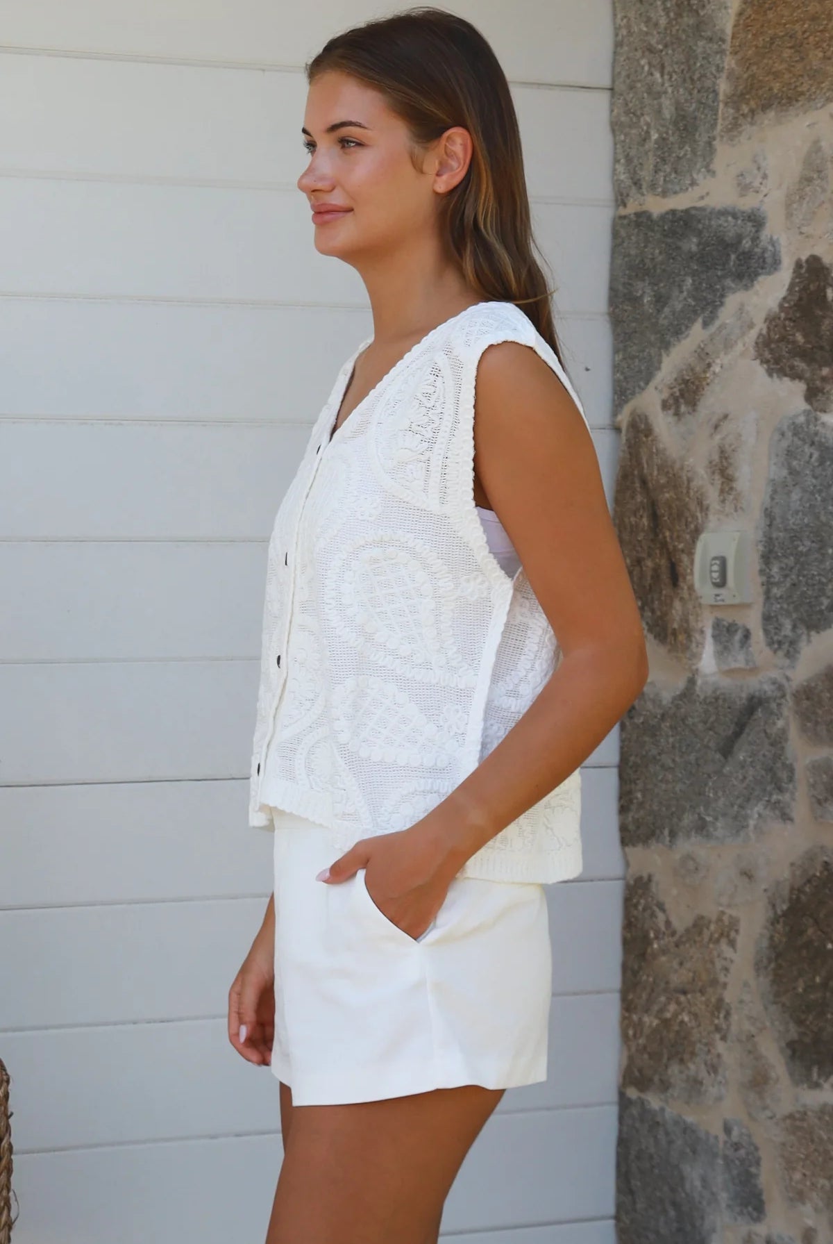 White cotton embroidered sleeveless vest with button front styled for Australian summer boho fashion