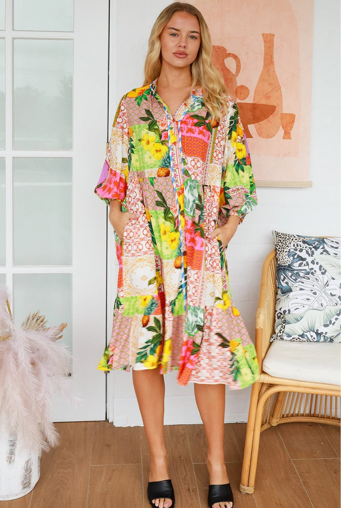 “Woman in a tropical bamboo patchwork boho midi dress with mandarin collar and belt – sustainable bohemian clothing Australia”