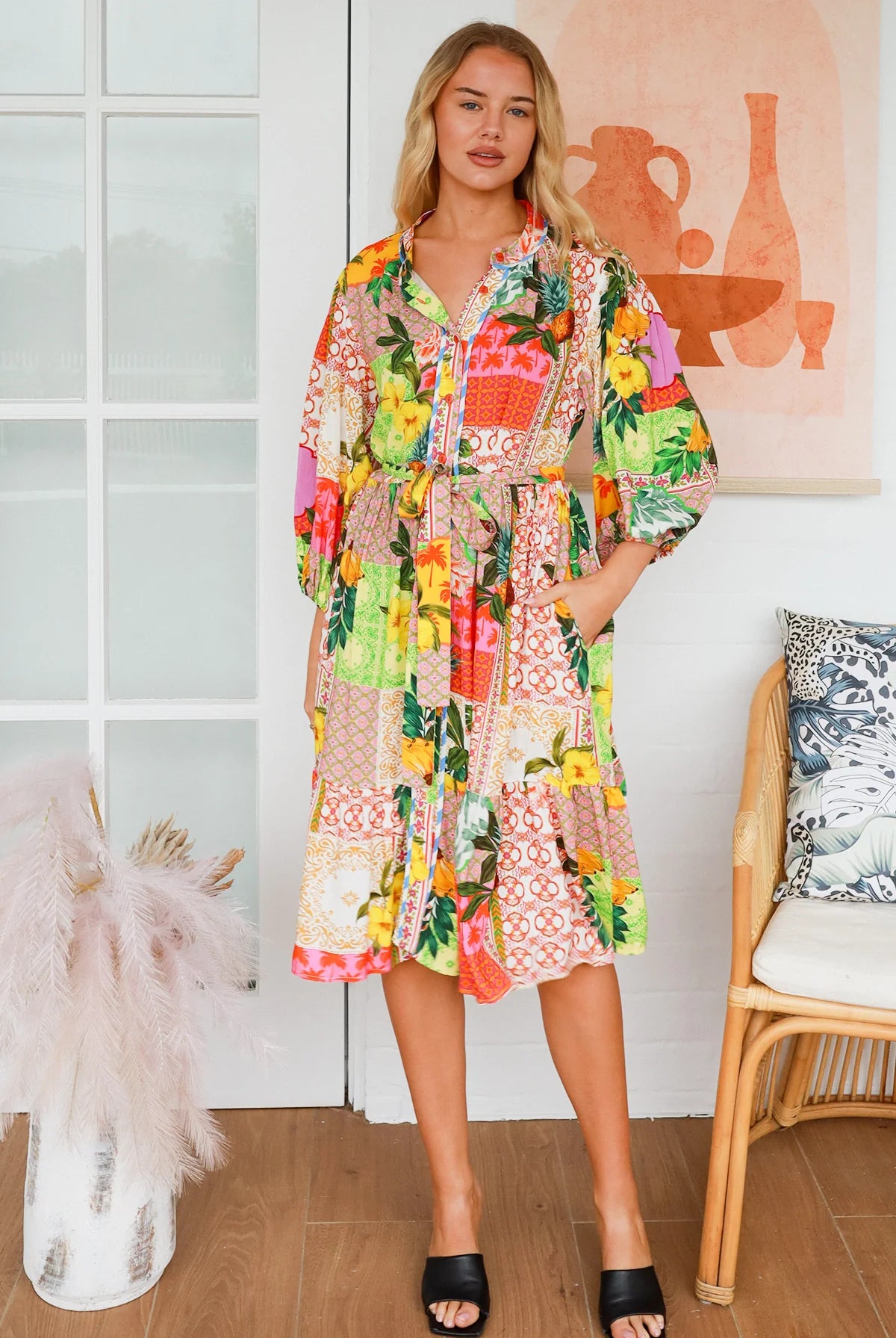 “Woman in a tropical bamboo patchwork boho midi dress with mandarin collar and belt – sustainable bohemian clothing Australia”