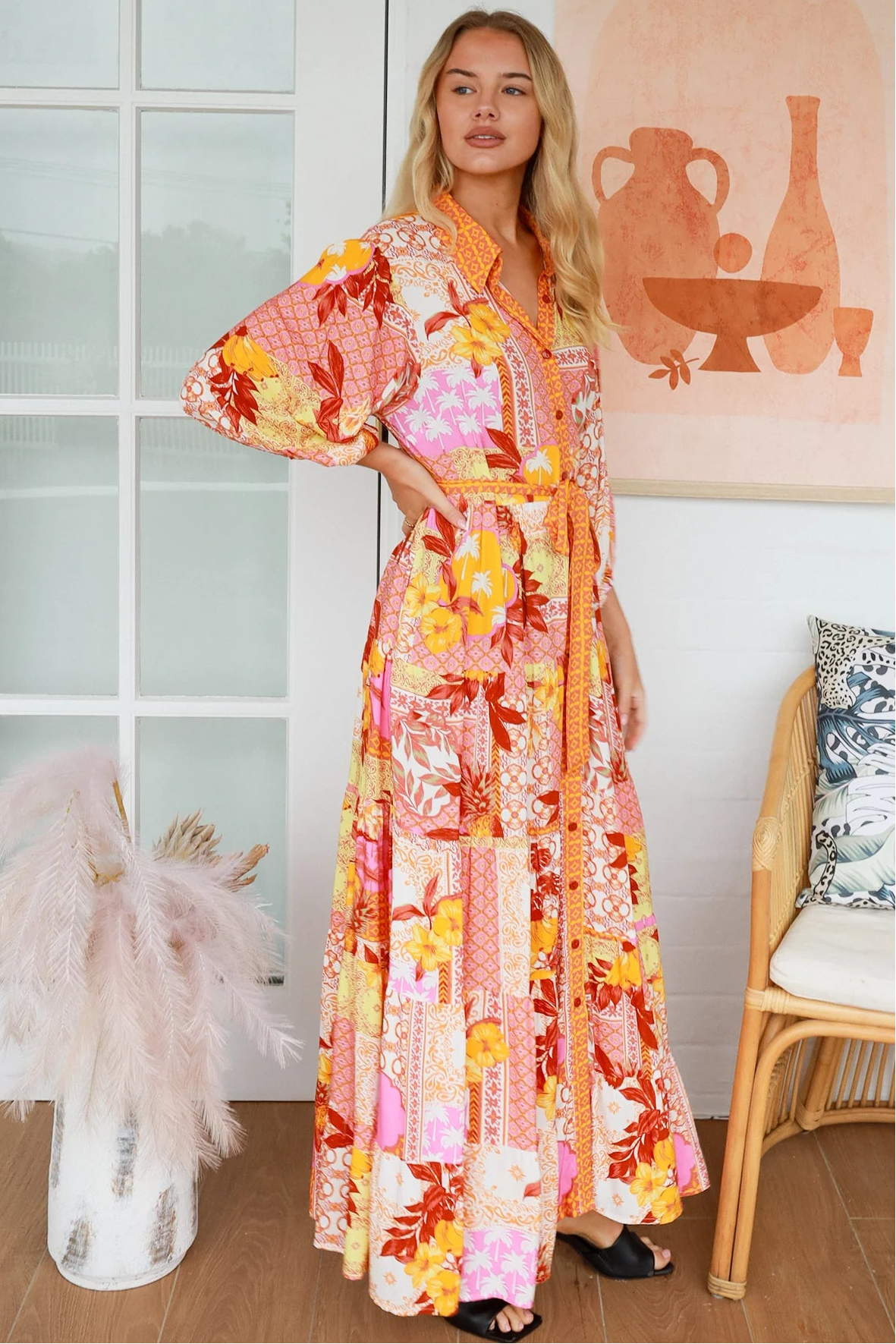 Jacqueline Floral Maxi Dress by Salty Palm in coral pink patchwork floral print with sash, pockets and button-through front