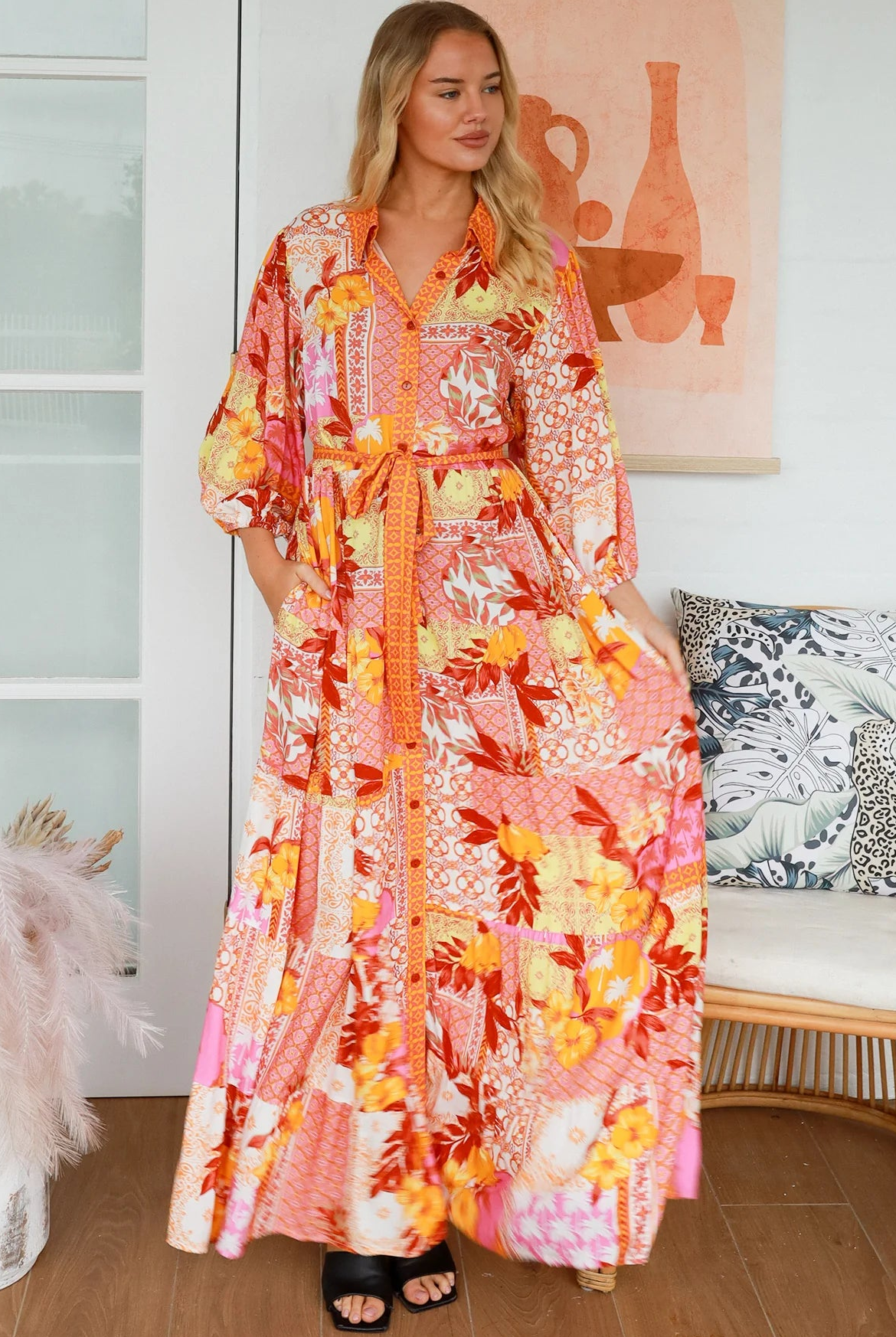 Jacqueline Floral Maxi Dress by Salty Palm in coral pink patchwork floral print with sash, pockets and button-through front