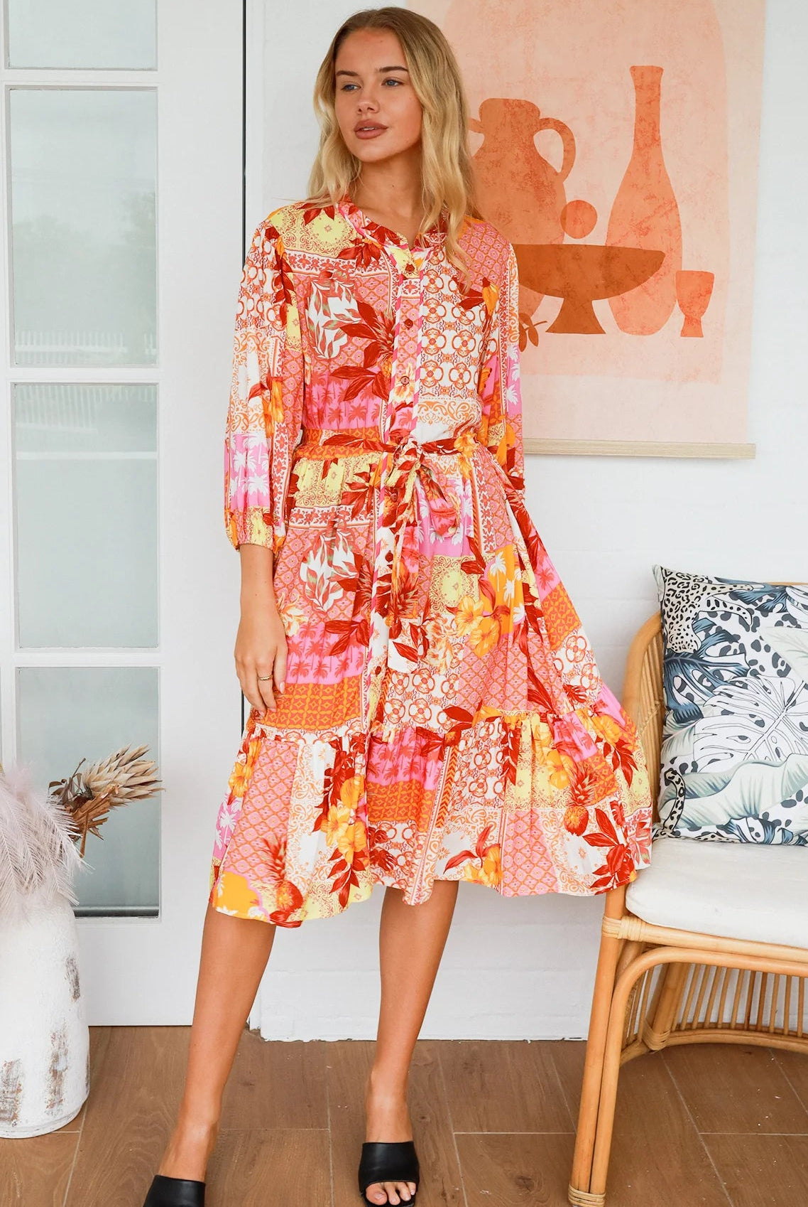 Jacqueline Floral Midi Dress by Salty Palm in coral pink patchwork floral print with split neckline and self-tie sash