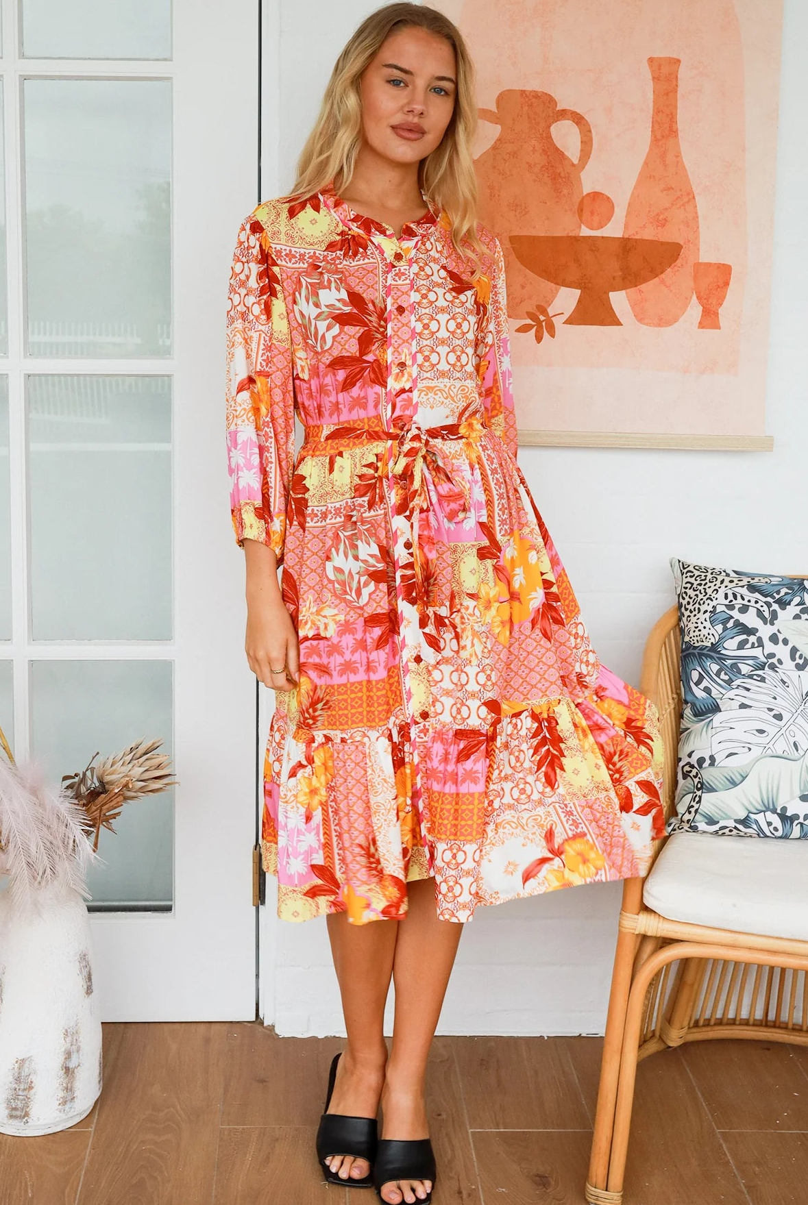 Jacqueline Floral Midi Dress by Salty Palm in coral pink patchwork floral print with split neckline and self-tie sash