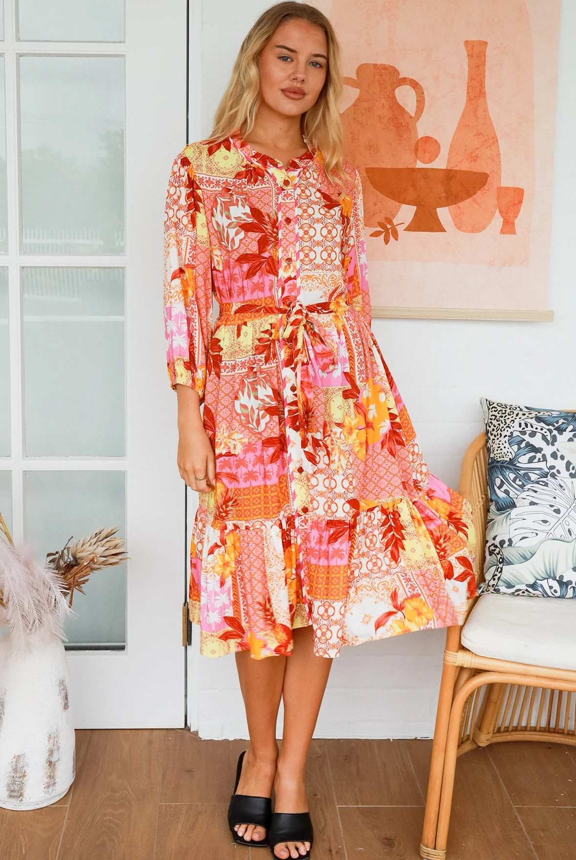Jacqueline Floral Midi Dress by Salty Palm in coral pink patchwork floral print with split neckline and self-tie sash