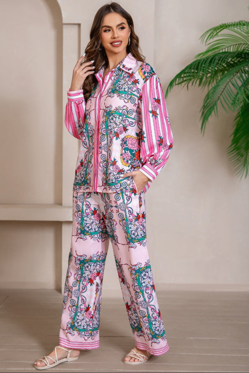 Model wearing pink floral baroque print shirt and wide-leg pants set with long sleeve and contrast piping - boho two-piece outfit Australia.