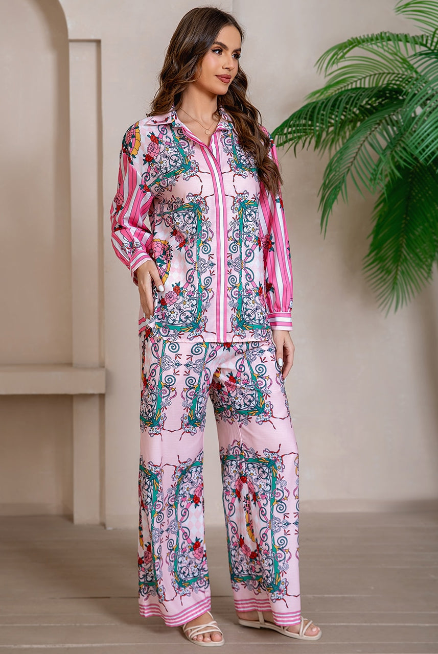 Model wearing pink floral baroque print shirt and wide-leg pants set with long sleeve and contrast piping - boho two-piece outfit Australia.
