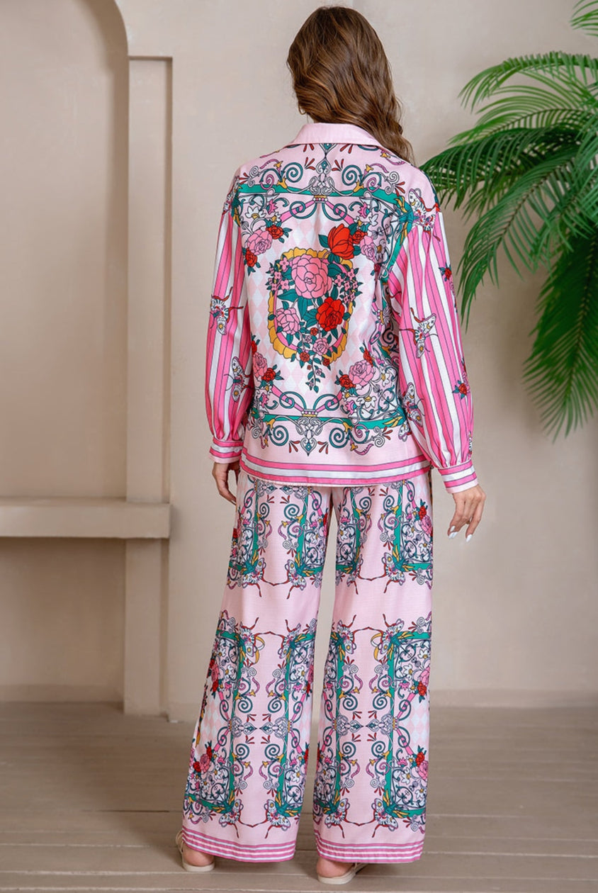 Model wearing pink floral baroque print shirt and wide-leg pants set with long sleeve and contrast piping - boho two-piece outfit Australia.