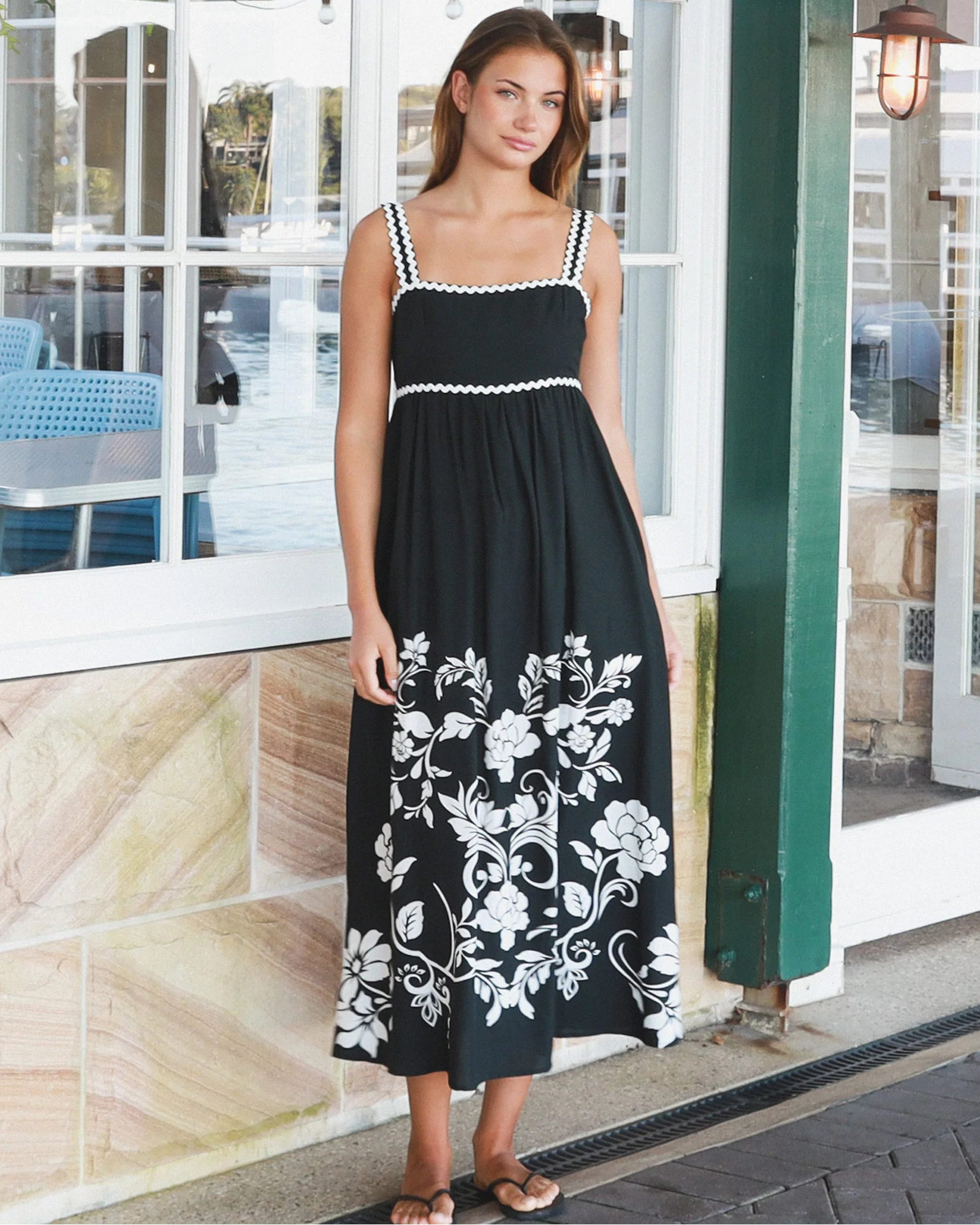 Black and white floral rayon maxi dress with tie-back detail against a black base styled for Australian boho fashion