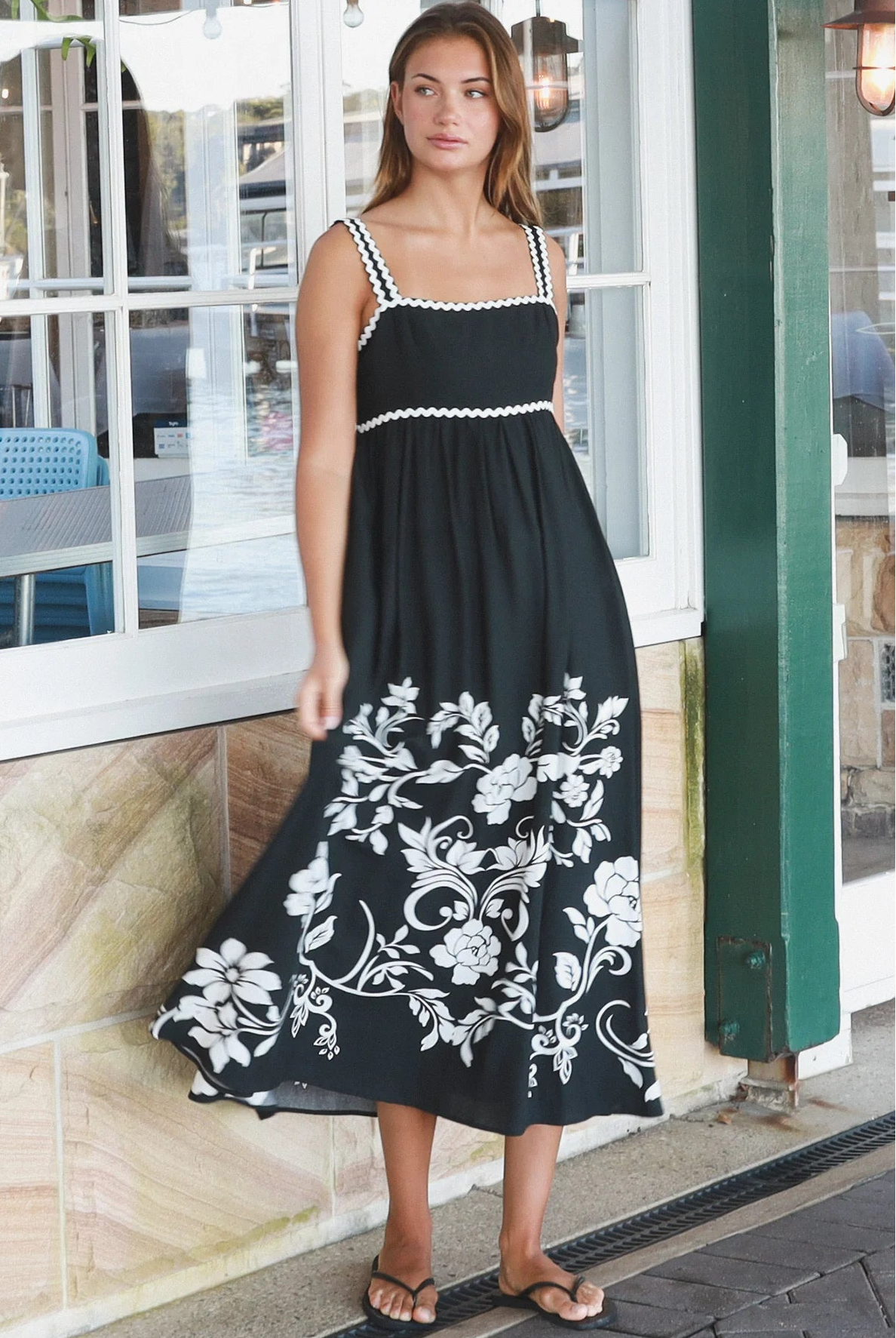 Black and white floral rayon maxi dress with tie-back detail against a black base styled for Australian boho fashion