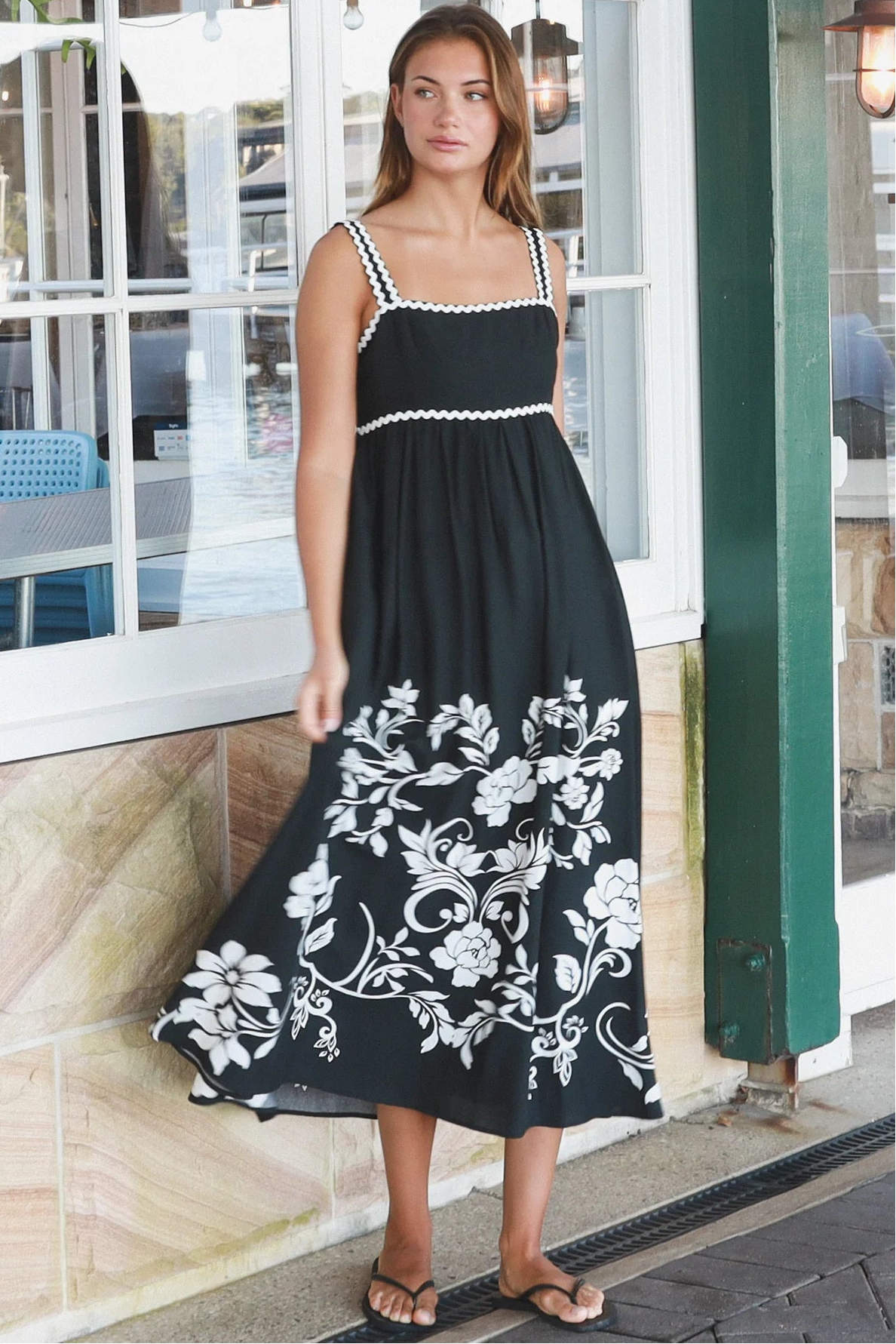 Black and white floral rayon maxi dress with tie-back detail against a black base styled for Australian boho fashion