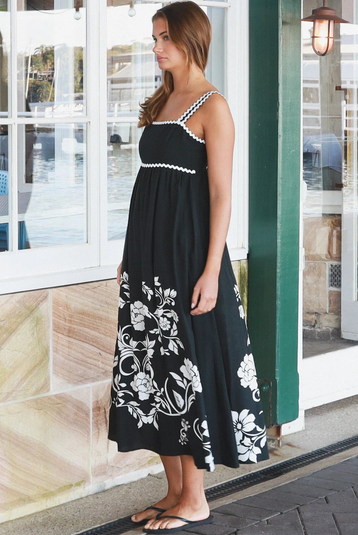 Black and white floral rayon maxi dress with tie-back detail against a black base styled for Australian boho fashion