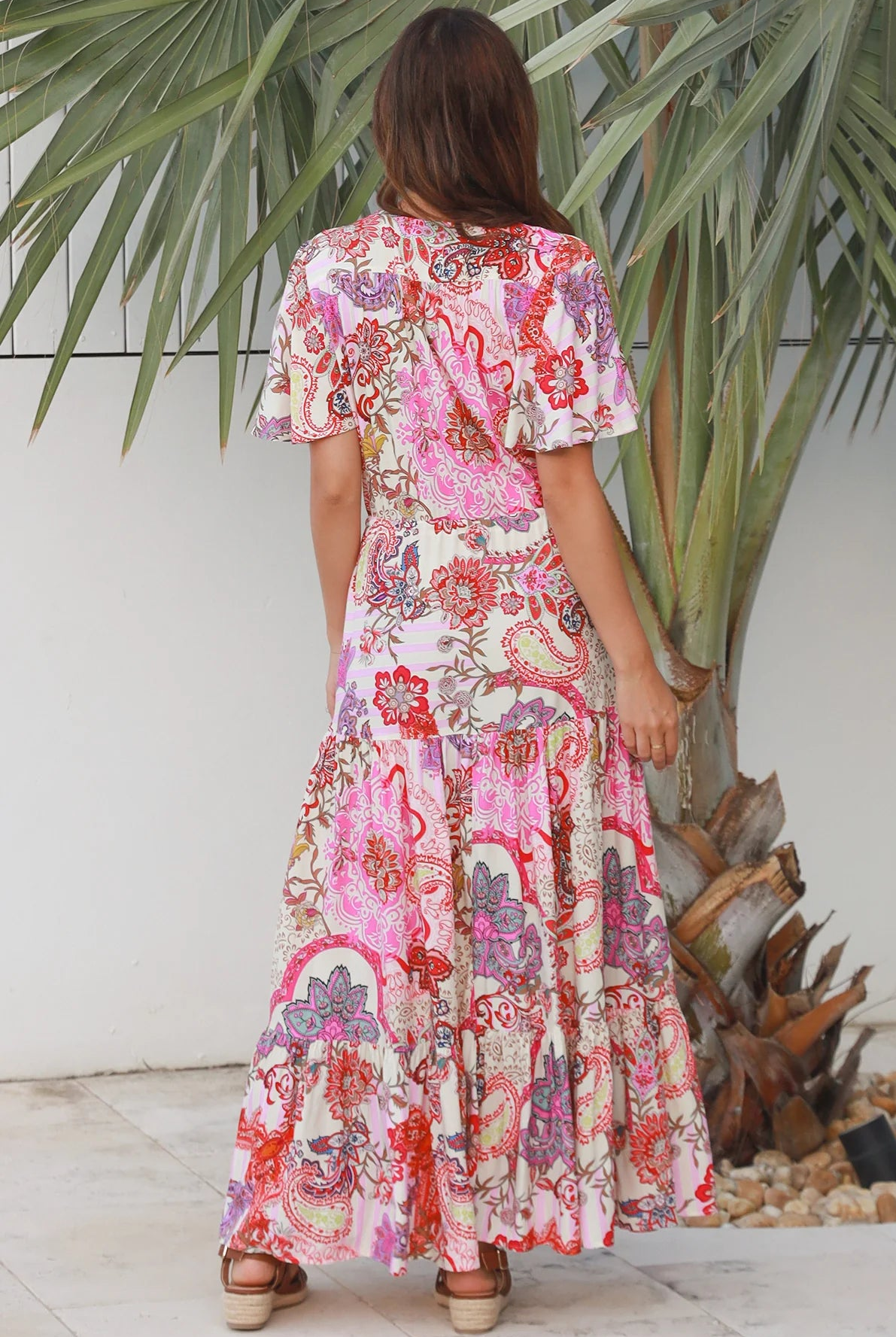 Pink paisley bohemian maxi dress with flutter sleeves, drawstring waist and tiered hem in softly draped rayon. Boho Dresses Australia.