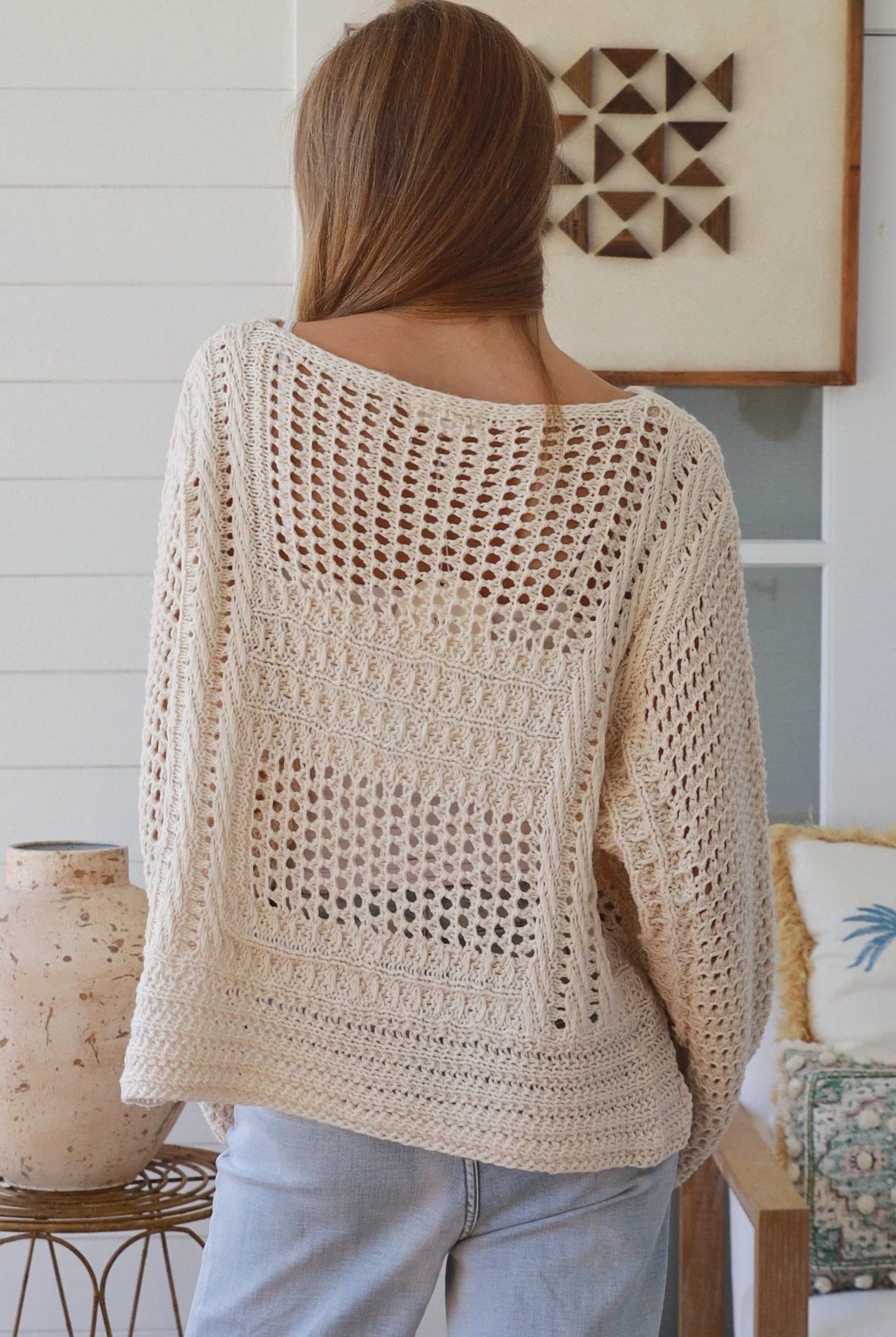 Cream crochet knit sweater with open weave relaxed fit boho top Australia styled with light wash denim jeans