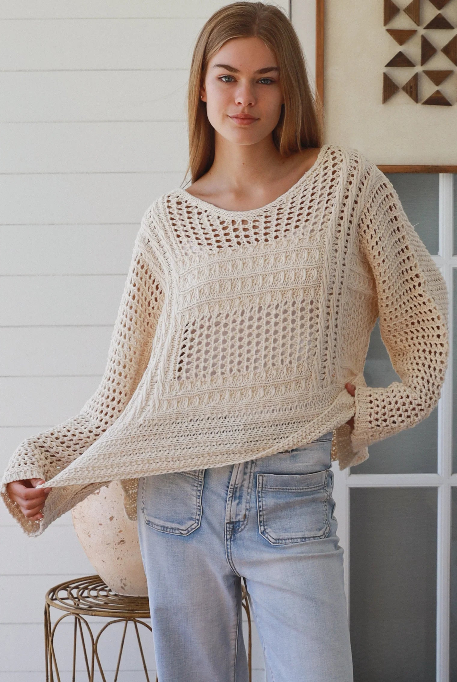 Cream crochet knit sweater with open weave relaxed fit boho top Australia styled with light wash denim jeans