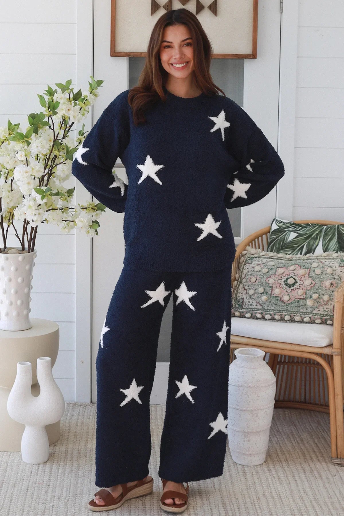 Charlotte The Label Star Soft Brushed Knit Pants in navy featuring a soft brushed knit, closely placed white star design, wide-leg silhouette and elastic waistband.