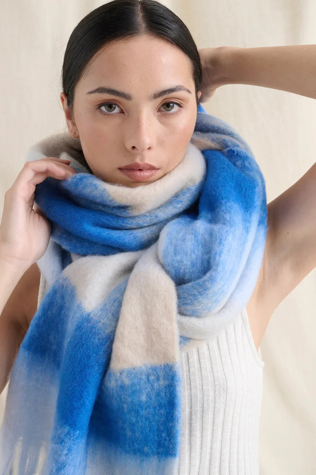 Winter Scarves Australia - woman wearing an oversized blue and cream soft brushed scarf.