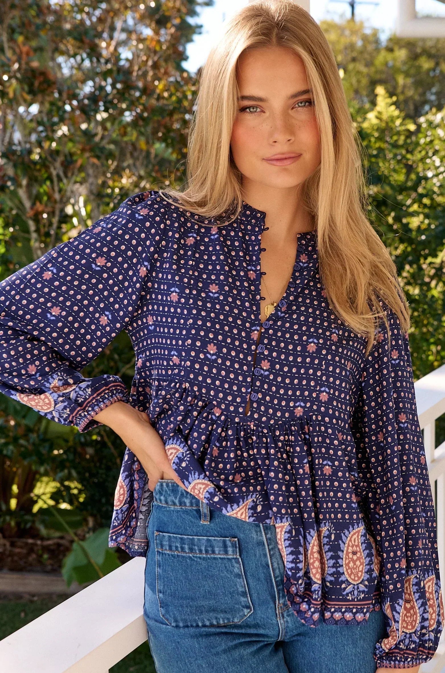 Model wearing a flowy boho blouse in soft earthy tones - shop boho tops Australia, feminine bohemian style online.