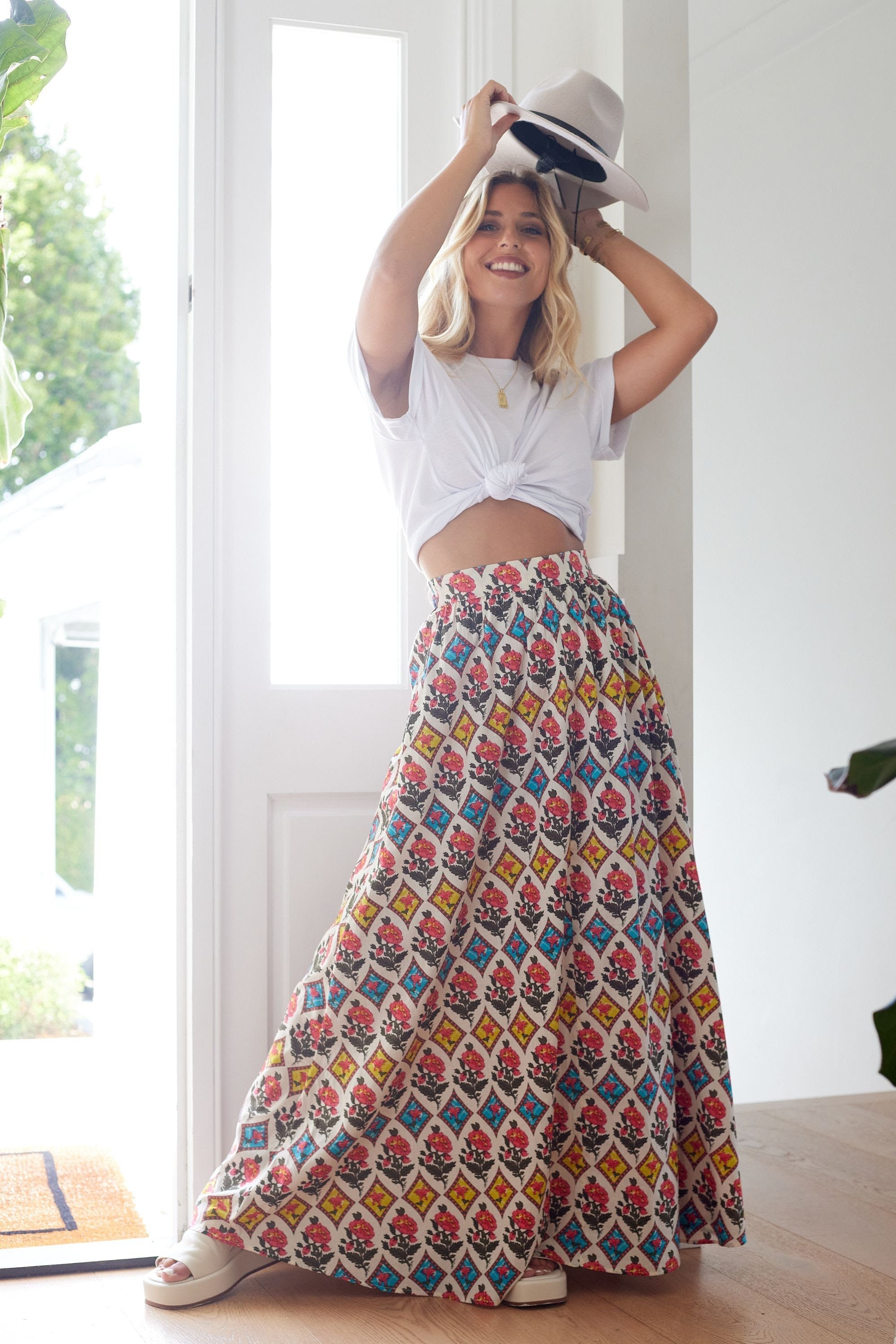 Model wearing the Calista boho maxi skirt with bold panel print and romantic silhouette.