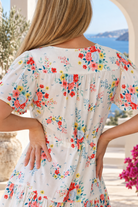 Salty Palm ivory floral boho mini dress in rayon with V-neck, flutter sleeves, drawstring waist and oversized frill hem