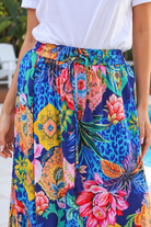 Wild Tropic blue boho maxi skirt with tropical floral print, side splits, tassel tie and flowing tiered hem