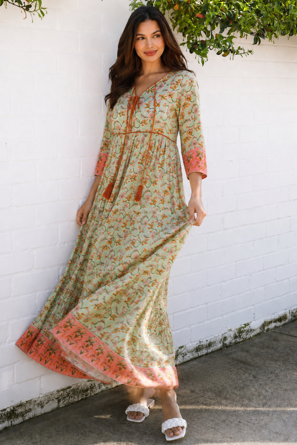 Lauren 100% cotton floral boho maxi dress in sage green with coral botanical print, tassel ties and contrast border hem