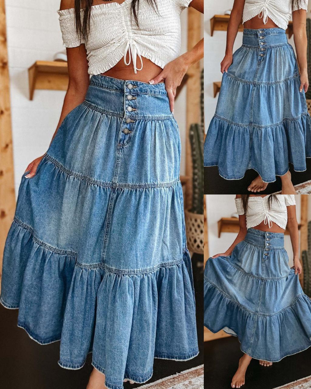 Woman in high-waisted tiered indigo cotton denim maxi skirt with button front - Bohemian Love Runway.