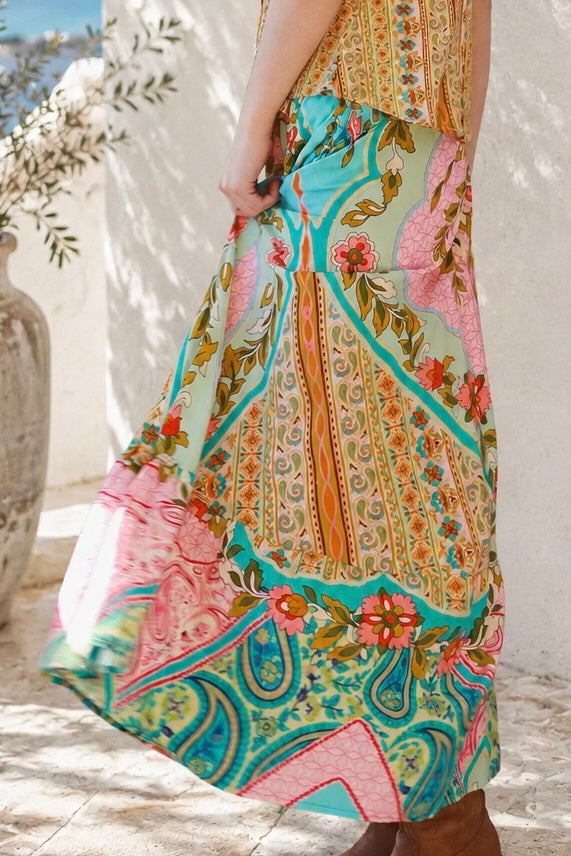 Amara floral boho maxi skirt in 100% rayon with colourful placement print, gathered frill hem and tassel tie
