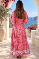 Eliana Bloom pink floral rayon boho maxi dress with V-neckline, smocked waist and tiered skirt.