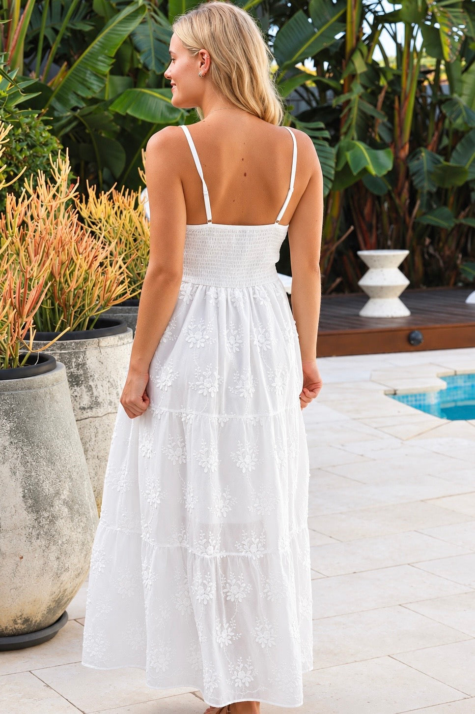 Olivia white embroidered cotton maxi dress with lace waist, tassel V-neck, adjustable straps and tiered skirt