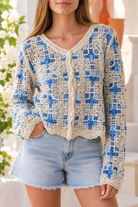Blue and ivory cotton crochet boho cardigan with intricate open weave, V-neck, buttons and scalloped edging
