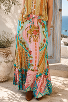Amara floral boho maxi skirt in 100% rayon with colourful placement print, gathered frill hem and tassel tie