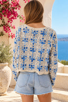 Blue and ivory cotton crochet boho cardigan with intricate open weave, V-neck, buttons and scalloped edging