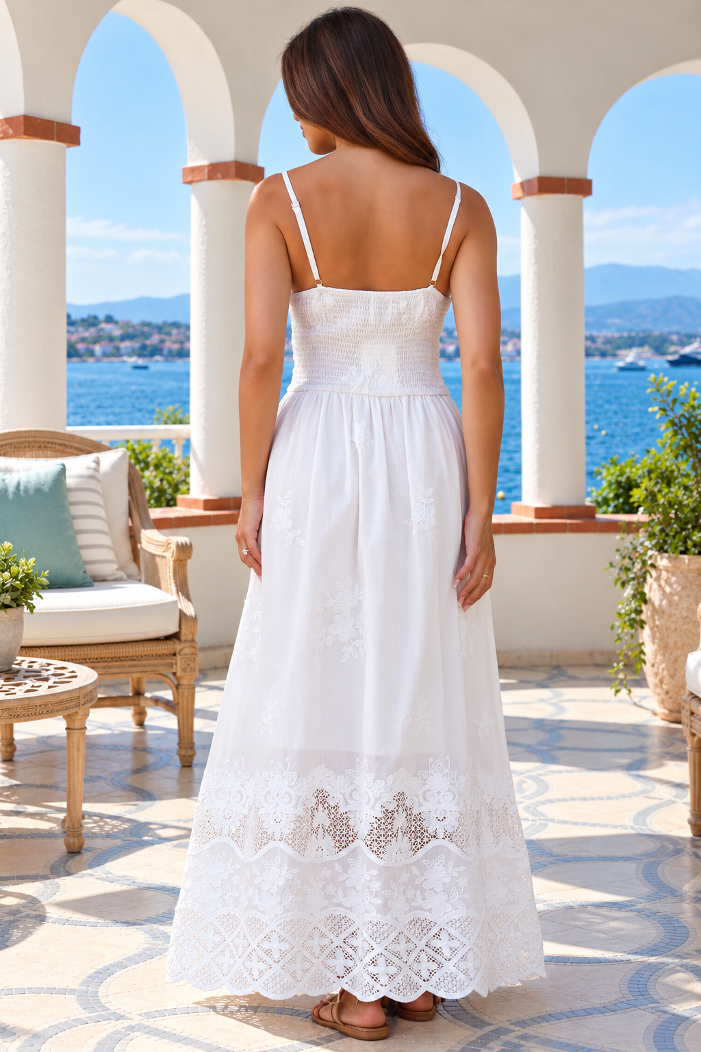 Lola white embroidered cotton maxi dress by Salty Palm featuring floral cutwork, adjustable straps, fitted waist and scalloped lace hem.