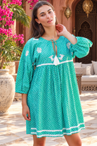 Maya jade cotton boho mini dress with white crab and coral embroidery, tassel neckline and three-quarter sleeves