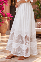 Isola white embroidered cotton maxi dress by Salty Palm with floral embroidery, button front, waist tie and openwork cotton lace panels | Bohemian Love Runway 