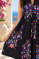 Peacock Feather cotton A-line swing dress in navy floral print with V-neck and pockets at Bohemian Love Runway