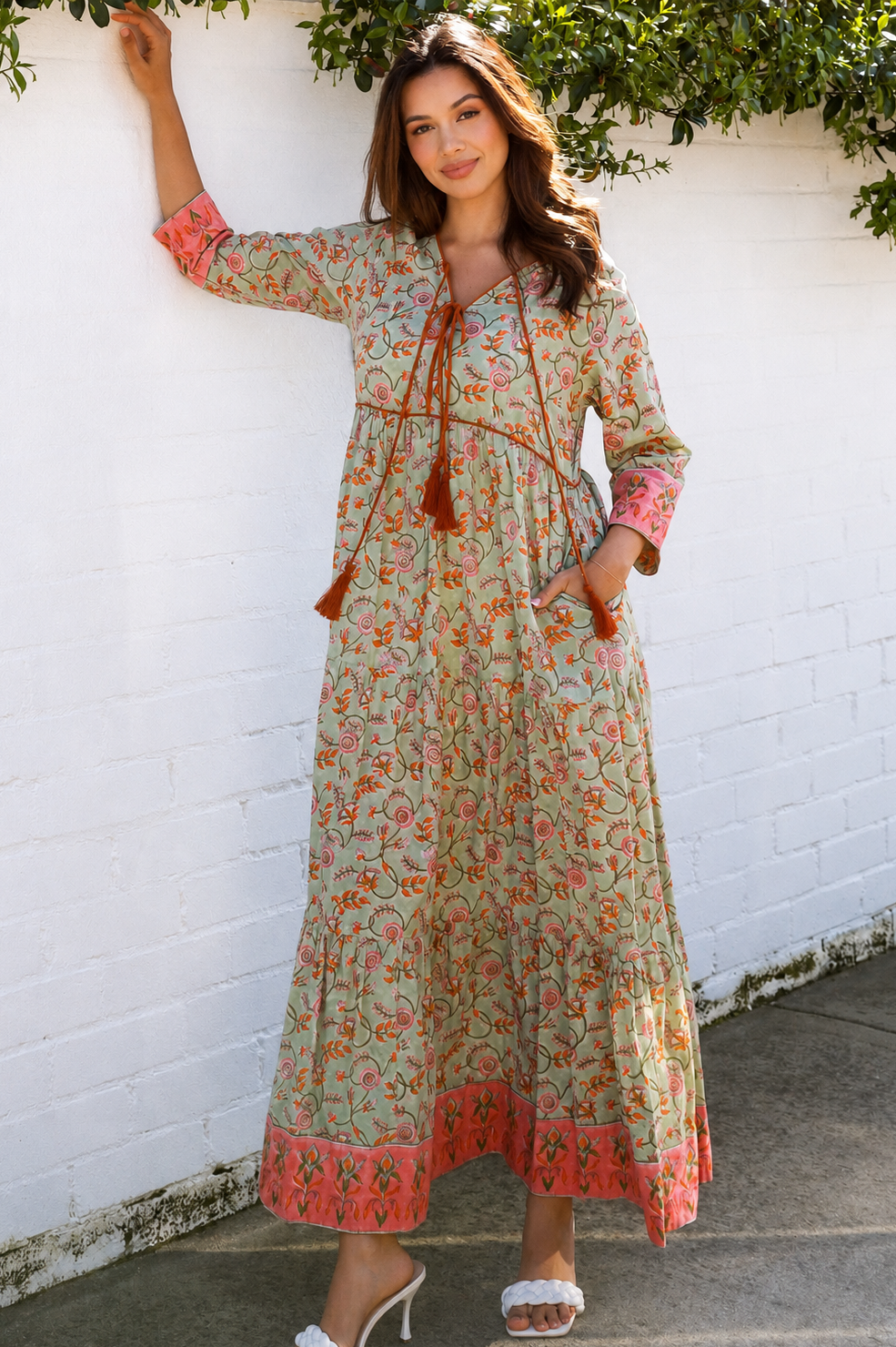 Lauren 100% cotton floral boho maxi dress in sage green with coral botanical print, tassel ties and contrast border hem