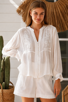 Paige white embroidered blouse by Salty Palm with floral panels, split neckline and long relaxed sleeves