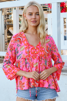 Sintra pink floral boho top with V-neck, button front, ties and three-quarter bell sleeves
