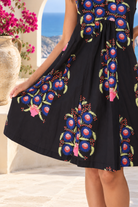 Peacock Feather cotton A-line swing dress in navy floral print with V-neck and pockets at Bohemian Love Runway