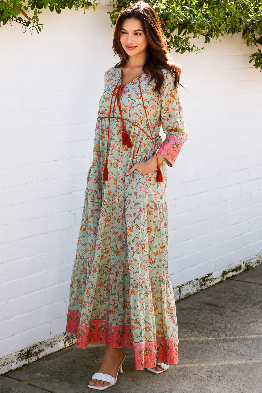 Lauren 100% cotton floral boho maxi dress in sage green with coral botanical print, tassel ties and contrast border hem