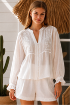 Paige white embroidered blouse by Salty Palm with floral panels, split neckline and long relaxed sleeves