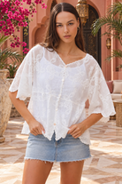 Giselle white boho embroidered cotton top by Willow the Label with scalloped V-neckline, floral embroidery and half sleeves
